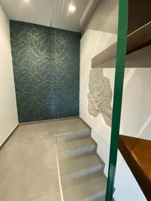 a staircase in a room with a wall at La Casetta Di Rosina in Caccamo