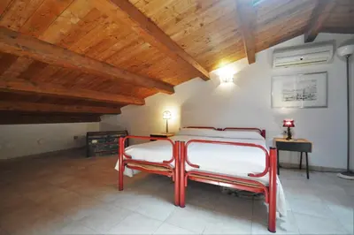 a bedroom with a bed and a wooden ceiling at Villa Mirage in Alcamo