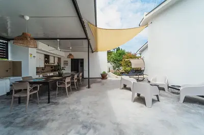 a kitchen and dining room with a table and chairs at Airport sicily home palermo in Carini