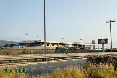 a building on the side of a road next to a highway at Airport sicily home palermo in Carini