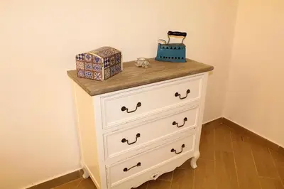 a dresser with two boxes on top of it at Ciuri di Sicilia in Capaci
