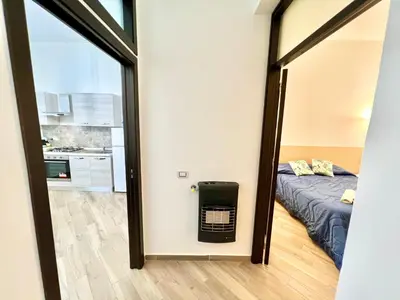 a view of a room with a bed and a mirror at Ciuri di Sicilia in Capaci