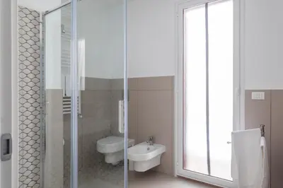 a bathroom with a shower and a toilet and a sink at il sogno di Saffo in Palermo