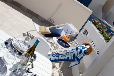 a table with a bottle of wine on top of it at Coral Holiday San Vito Lo Capo in San Vito lo Capo