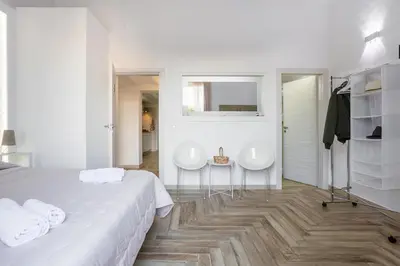 a white bedroom with two sinks and a bed at Calypso Il Binario Elegance in Palermo