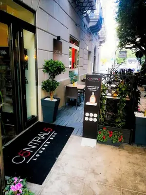 a store entrance with a sign in front of a store at Calypso Il Binario Elegance in Palermo