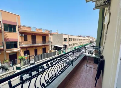 a balcony of a building with a view of a street at Casa Kennedy in Capaci