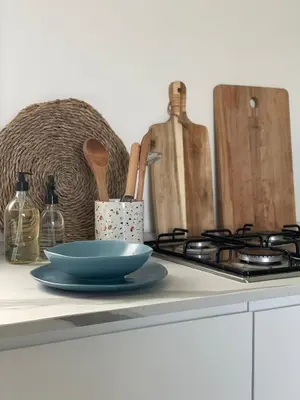 a blue bowl on a counter next to a stove at Cocciu d’amuri in Terrasini