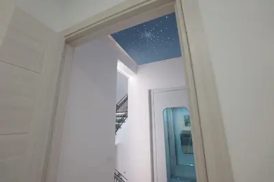 a hallway with a starry sky seen through a doorway at Stabile HolidayHome in Castellammare del Golfo