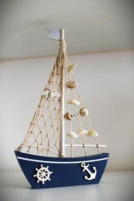 a model of a boat withautical items on it at Casa gianflò in Palermo