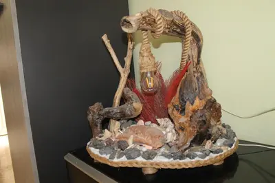 a dinosaur statue sitting on top of a table at Casa gianflò in Palermo