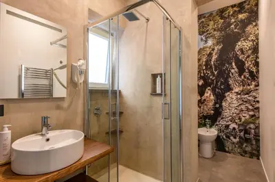 a bathroom with a sink and a shower at Villena Plaza by Wonderful Italy in Palermo