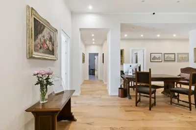 a living room with a vase of flowers on a table at GuestHost - NotHotel Palermo Luxury Guest House in Palermo