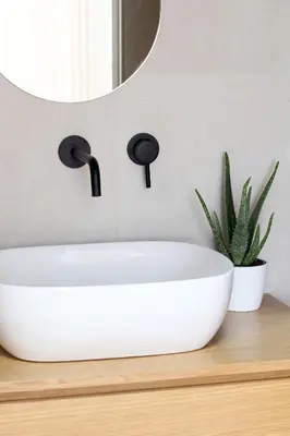 a bathroom with a white sink and a mirror at Pànto - Rooftop boutique rooms in Palermo