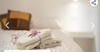 a pile of towels sitting on a table at Appartamento francy in Castellammare del Golfo