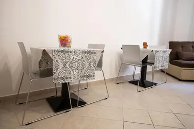 a dining room with a table and chairs at La casa di Nana’ locazione turistica in Palermo