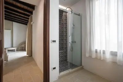 a walk in shower in a bathroom with a glass door at Villa a 300 Mt. dal Mare (Magaggiari) con campo da tennis in Cinisi
