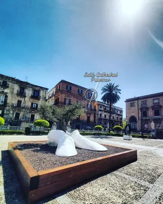 a sculpture of two animals sitting in a park at Suite Cathedral Palermo in Palermo