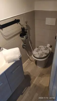 a bathroom with a toilet and a sink at Rigoletto Holiday Home,Centrocittà Palermo in Palermo