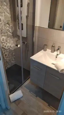 a bathroom with a shower and a sink and a showerspective at Rigoletto Holiday Home,Centrocittà Palermo in Palermo