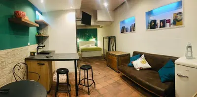 a living room with a couch and a table at ne mia in Palermo