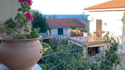 a large flower pot sitting on the side of a building at A casa di Eugenio in Carini