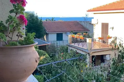 a large flower pot sitting on the side of a building at A casa di Eugenio in Carini
