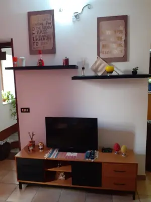 a living room with a tv and a coffee table at Home Casa Professa 1 in Palermo