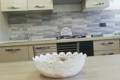 a bowl sitting on a table in a kitchen at Isabella house in Casteldaccia