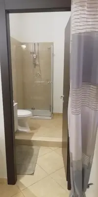 a bathroom with a shower and a toilet at Isabella house in Casteldaccia
