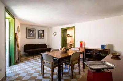 a living room with a table and chairs and a couch at Surplus Charming Apartment in Palermo