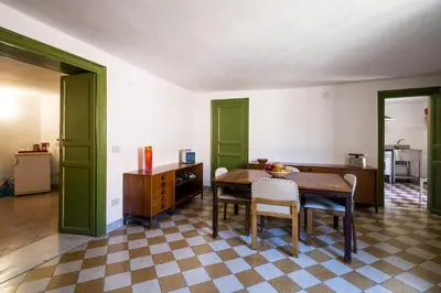 a dining room with a table and chairs at Surplus Charming Apartment in Palermo
