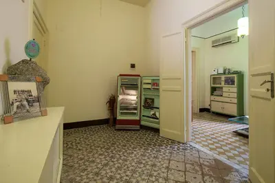 a kitchen with an open refrigerator in a room at Casa Particular Luxury in Palermo
