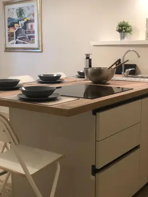 a kitchen counter with two bowls on top of it at BARRIQUE Guest House in Palermo