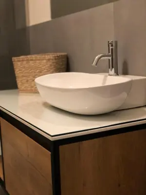 a white bowl sink on a counter in a bathroom at BARRIQUE Guest House in Palermo