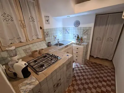 an overhead view of a kitchen with a stove top at Agorà Sant’anna Apartment in Palermo