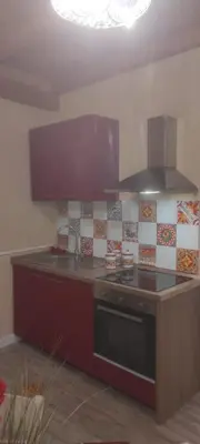 a kitchen with a stove and a counter top at Luxury Apartment Via Genova in Palermo