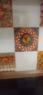 a wall with different colored tiles on it at Luxury Apartment Via Genova in Palermo