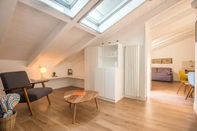 an attic living room with a skylight at Le Niche Holiday Homes by Wonderful Italy in Palermo