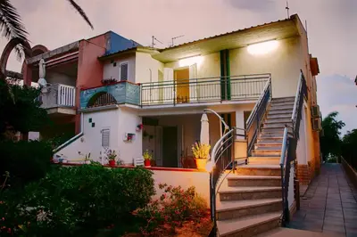 a house with stairs leading up to it at Terrazza sul Golfo in Alcamo