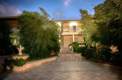 a large house with a walkway in front of it at Terrazza sul Golfo in Alcamo