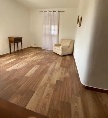 a living room with a couch and a table at Casa Vacanza in Trabia