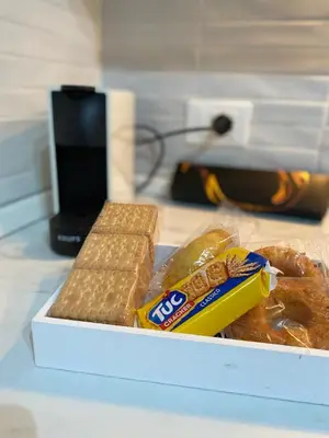 a box of bread and pastries on a counter at Tanto di Cappello Home in Palermo