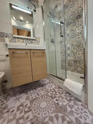 a bathroom with a shower and a sink at Tanto di Cappello Home in Palermo