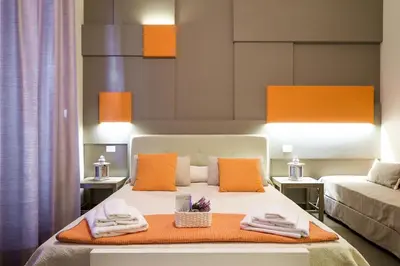 a bedroom with a bed with towels on it at Gran Cancelliere Apartment Parking in Palermo