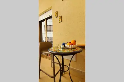 a table in a room with a bowl of fruit on it at LIBERTYHOUSE in Palermo