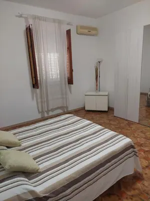 a bedroom with a large bed in a room at Appartamento a Mondello in Mondello