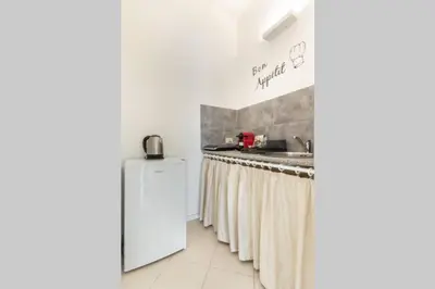a kitchen with a sink and a counter top at La Lumia - Al Politeama in Palermo