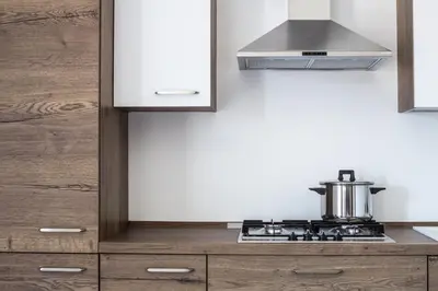 a kitchen with a stove with a pot on it at M'Place Apartments in Palermo