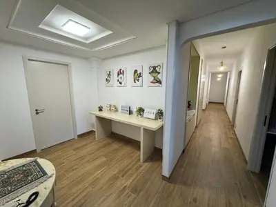 a room with a desk and a hallway at Made In Sicilia -IN CENTRO, ARIA CONDIZIONATA e NO ZTL- CITY CENTRE, AIRCON and NO LTZ in Castellammare del Golfo